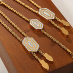 Simple and personalized light luxury wind titanium steel gold-plated hexagonal pendant with diamond pull-out buckle jewelry set for women